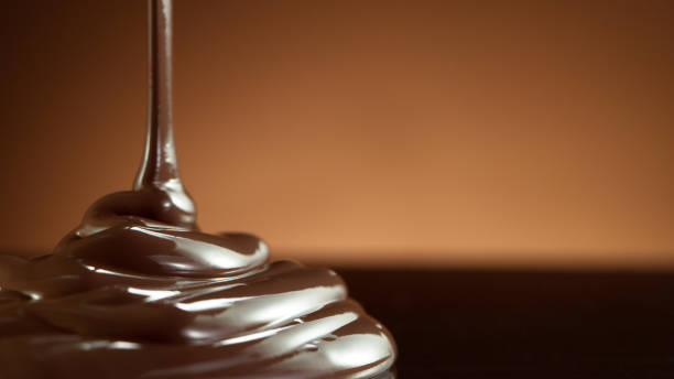 istock Detail of pouring hot chcocolate on table 1279961221
