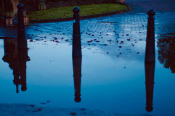 istock City reflection in a water puddle 1279961317
