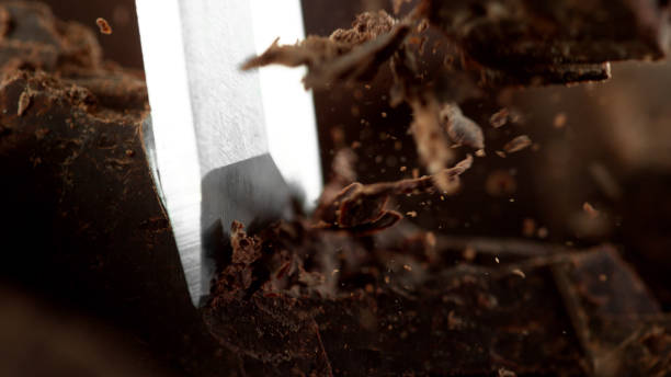 istock Detail of chisel cutting off raw chocolate 1279961324