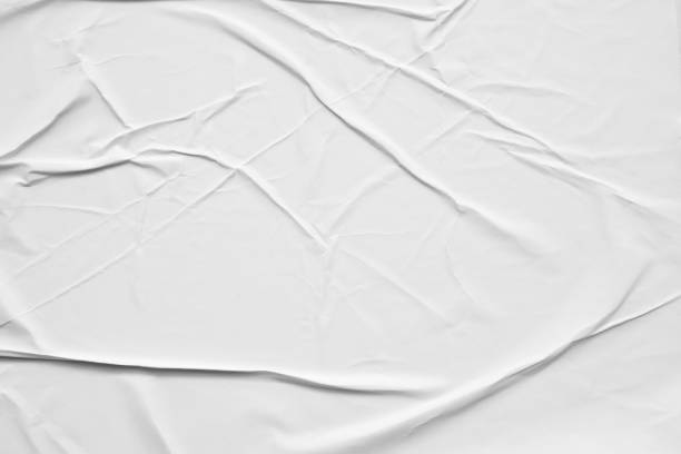 istock Blank white crumpled and creased paper poster texture background 1279963702