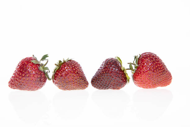 Strawberries placed on a wooden tray with soft background , selective focus