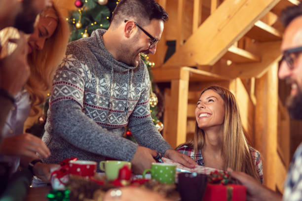 istock Friends exchanging Christmas presents 1279965000
