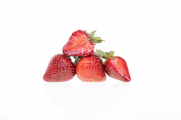 red raw fresh strawberries on white background, close view