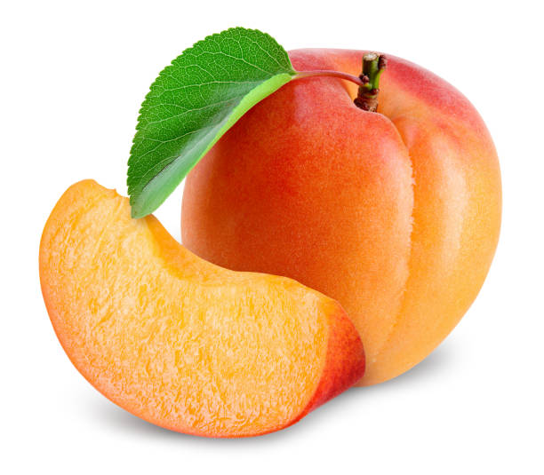 istock Apricot. Apricots isolate. Apricot with slice on white. Fresh apricot leaf. With clipping path. Full depth of field. 1279965575