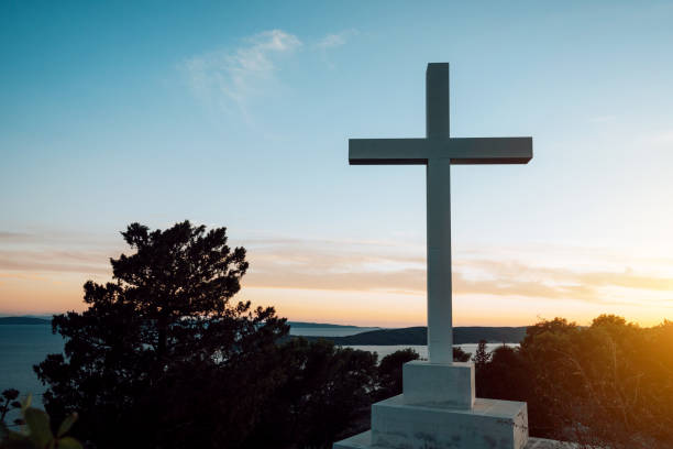 istock Giant Cross against sunset sky 1279966661