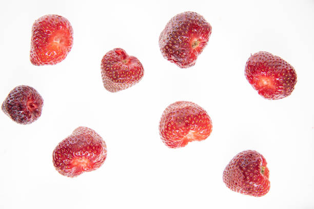 istock red raw fresh strawberry on white background, close view 1279967107
