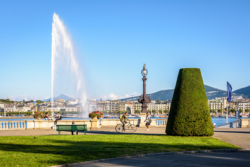 Geneva, Switzerland - September 8, 2020: The Mont Blanc rotunda is a  public square on the right bank of the Lake Geneva with a view over the Jet d'Eau water jet fountain and the Mont Blanc.
