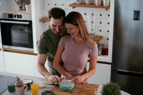 istock Young couple making breakfast at home. 1279967970
