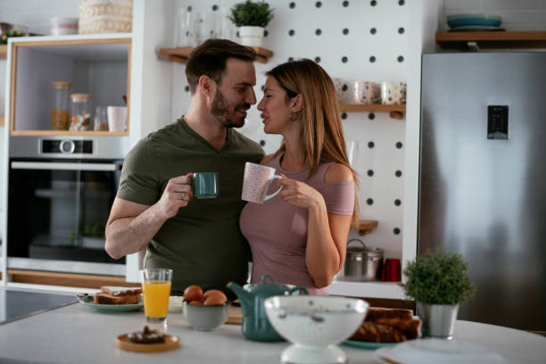 istock Young couple making breakfast at home. 1279968110