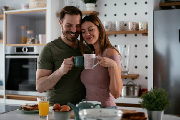 istock Young couple making breakfast at home. 1279968282