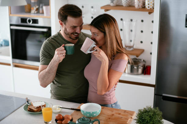 istock Young couple making breakfast at home. 1279968286