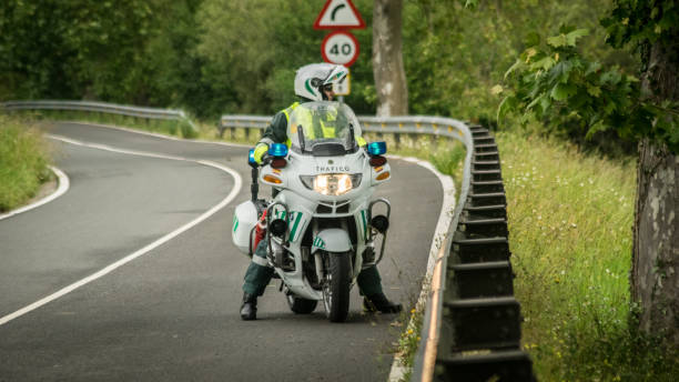 Civil guard agent Labarces, Spain; 03/06/2017: Guardia Civil agent on his patrol motorcycle. civilian stock pictures, royalty-free photos & images