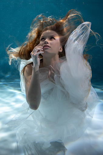 young beautiful woman in swimming pool