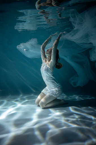 Beautiful Girl In White Dress Underwater Water Magic Underwater Photography  Art Stock Photo - Download Image Now - iStock