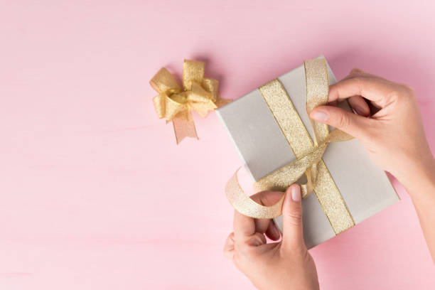 istock Silver gift box decorated with golden ribbon bow,Present packing for giving 1279971278