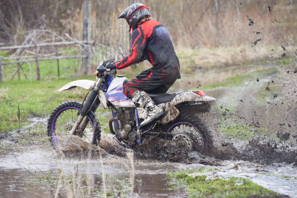 istock Motorcross rider racing in dirt track 1279971424