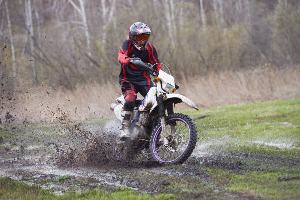 istock Motorcross rider racing in mud track 1279971460