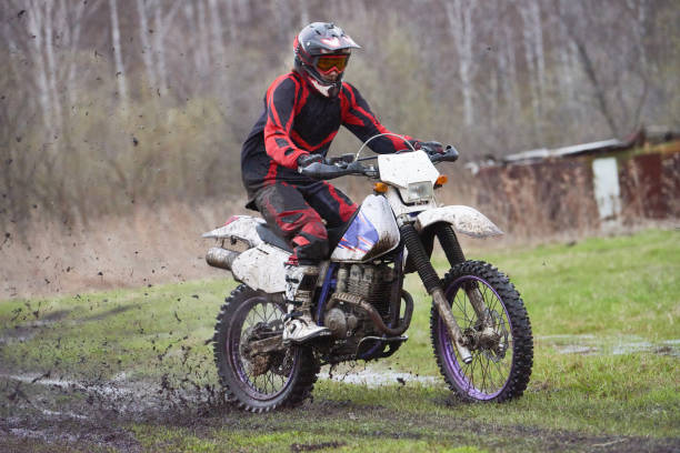 istock Motorcross rider racing in mud track 1279971527