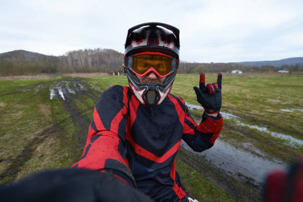 istock Motorcross rider posing for selfie 1279971528