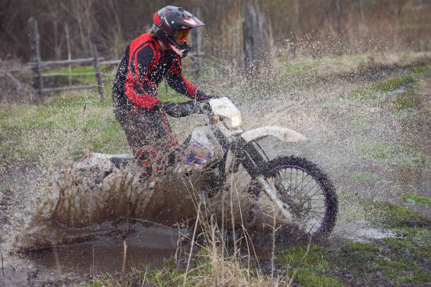 istock Motorcoss rider racing in the countryside 1279972064
