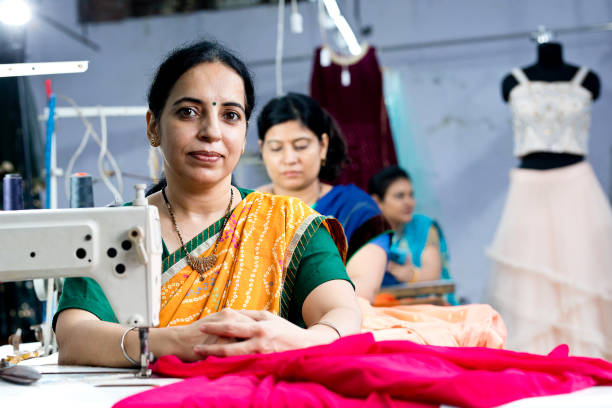 istock Indian woman textile worker on production line 1279972279