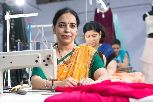 istock Indian woman textile worker on production line 1279972345