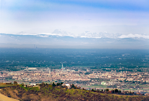 Modena city seen from the Appennines with the Alpes and Dolomites in the background