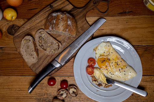 healthy breakfast: walnut wholegrain bread, fried egg and fruits