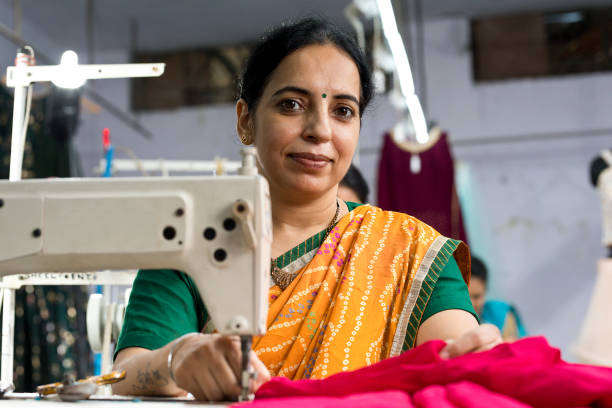 istock Indian woman textile worker on production line 1279972661