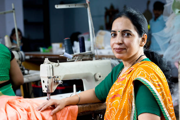 istock Indian woman textile worker on production line 1279972694