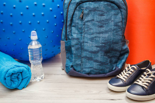 istock Different tools for fitness on floor in room 1279972895