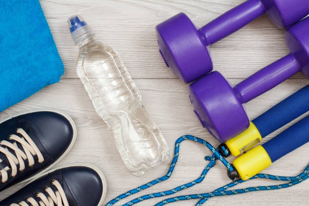 istock Different tools for fitness on floor in room 1279973021