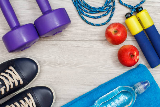 istock Different tools for fitness on floor in room 1279973599