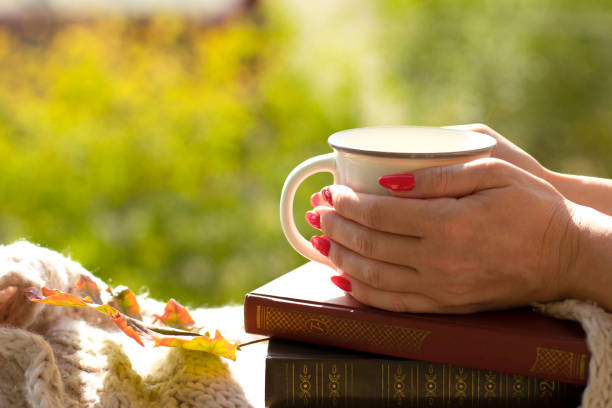 Breakfast on a Sunny morning outside. Cup of coffee in hand. Space for text