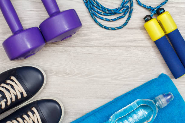istock Different tools for fitness on floor in room 1279973741