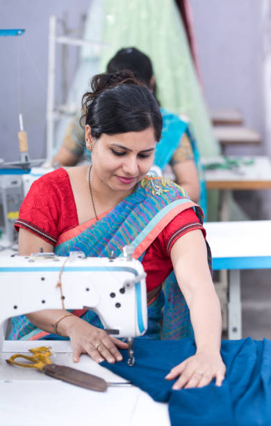 istock Indian woman textile worker on production line 1279973775