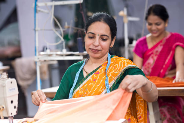 istock Indian woman textile worker on production line 1279974011