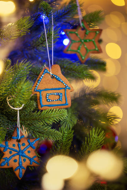 istock Homemade gingerbread as decoration on christmas tree, selective focus 1279974032