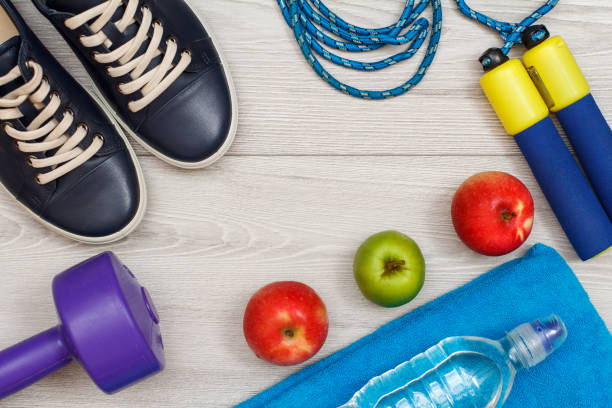 istock Different tools for fitness on floor in room 1279974038