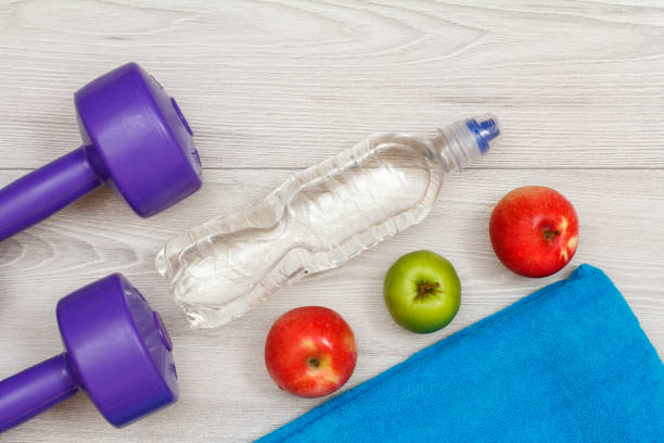 istock Different tools for fitness on floor in room 1279974058