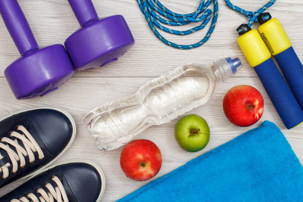 istock Different tools for fitness on floor in room 1279974167