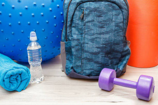 istock Backpack and different tools for fitness on floor in room 1279974169