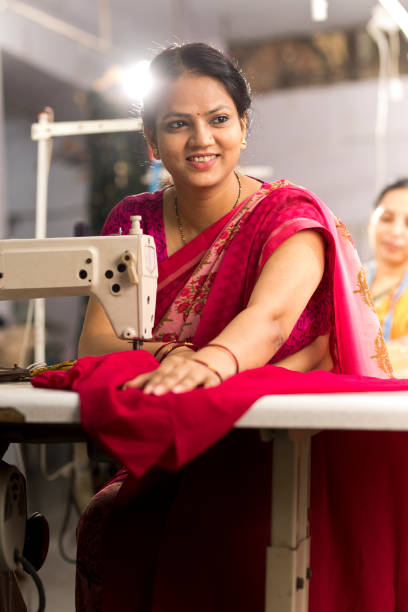 istock Indian woman textile worker on production line 1279974173
