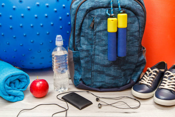 istock Backpack and different tools for fitness on floor in room 1279974187