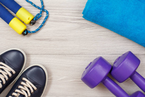 istock Different tools for fitness on floor in room 1279974296