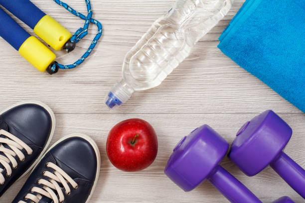 istock Different tools for fitness on floor in room 1279974299