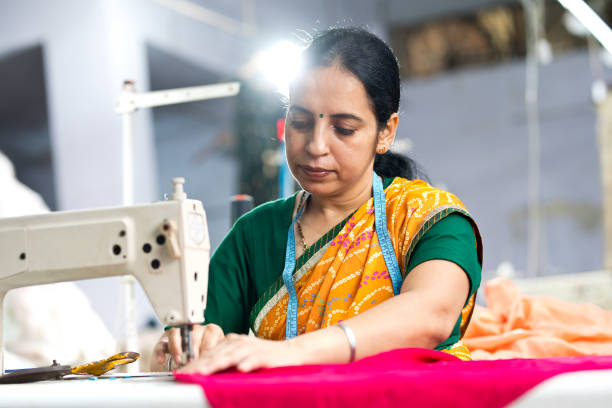 istock Indian woman textile worker on production line 1279974301