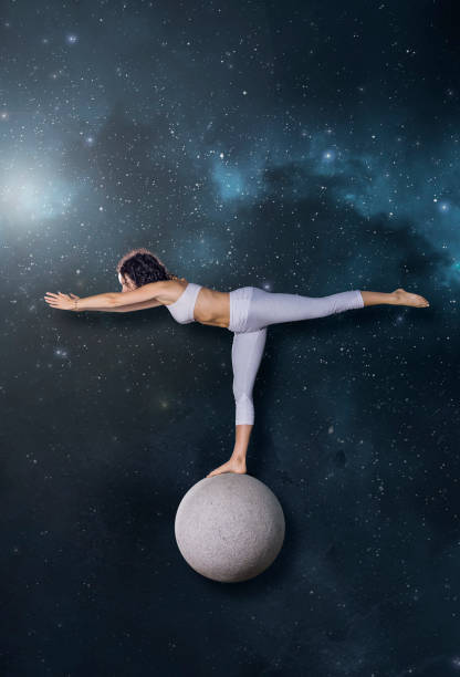 istock Beautiful woman yoga pose standing on sphere 1279975249