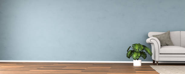 istock Elegant interior setting with wooden floor, dark textured wall, sofa, carpet and monstrea deliciosa plant. Copy space to the left - web banner size. 3d render. 1279975322