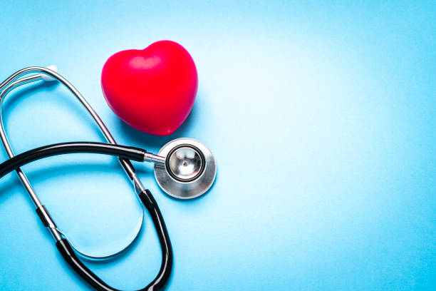 istock Stethoscope and red heart on blue background. Copy space 1279975624
